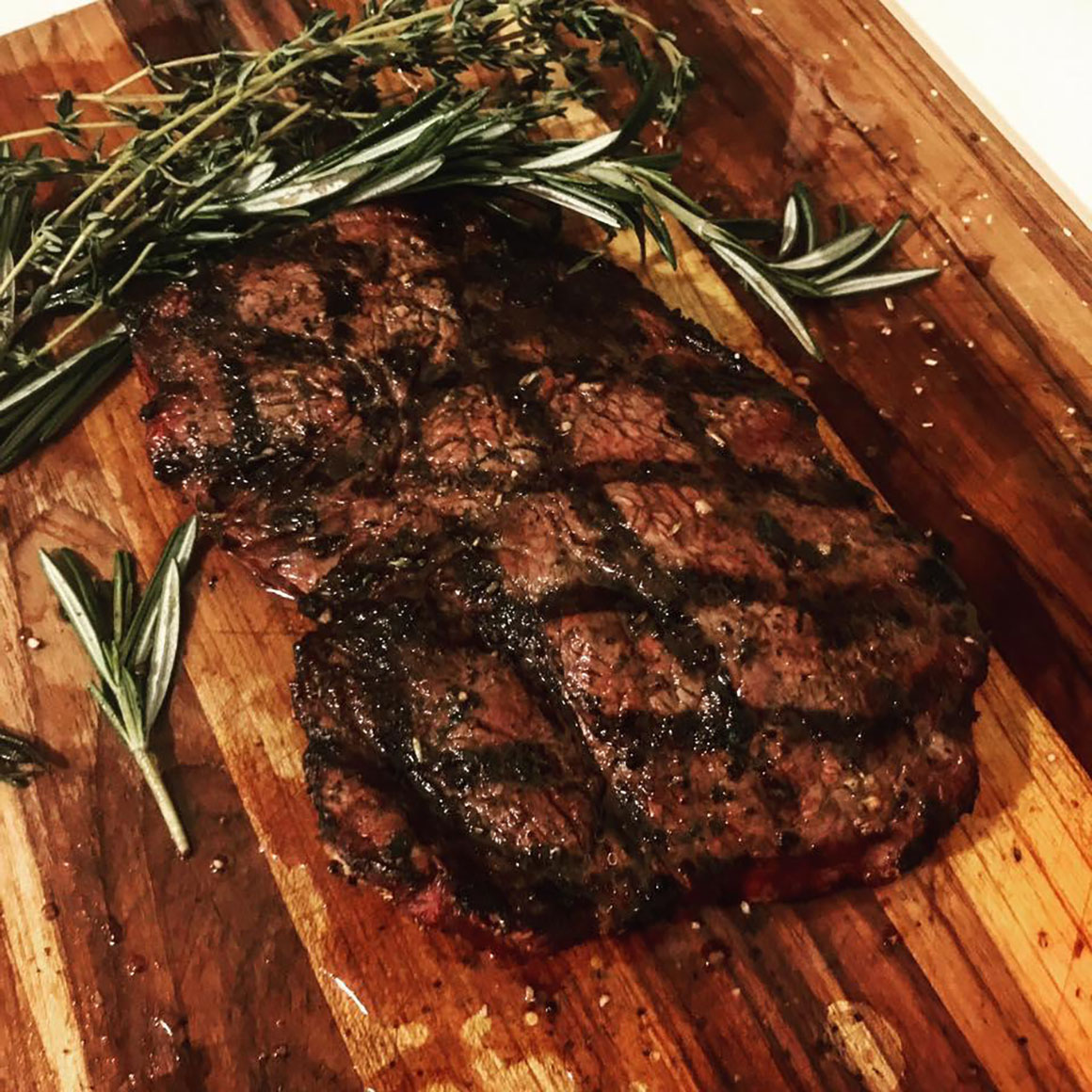 grilled steak on cutting board