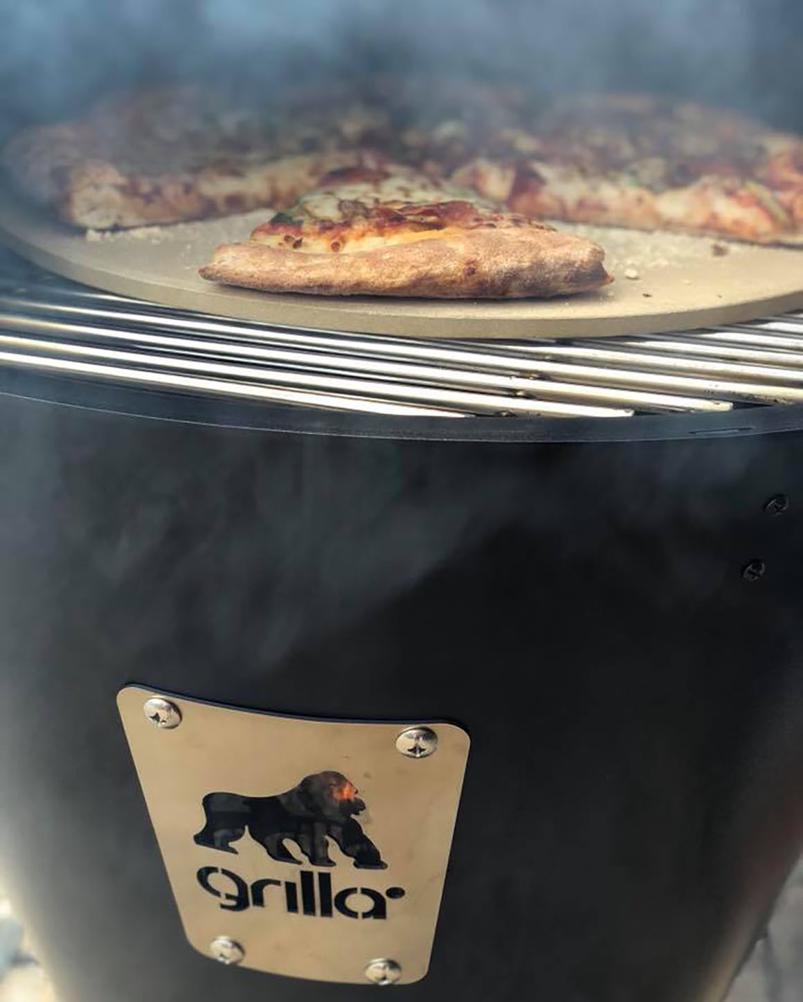 pizza grilling on pizza stone