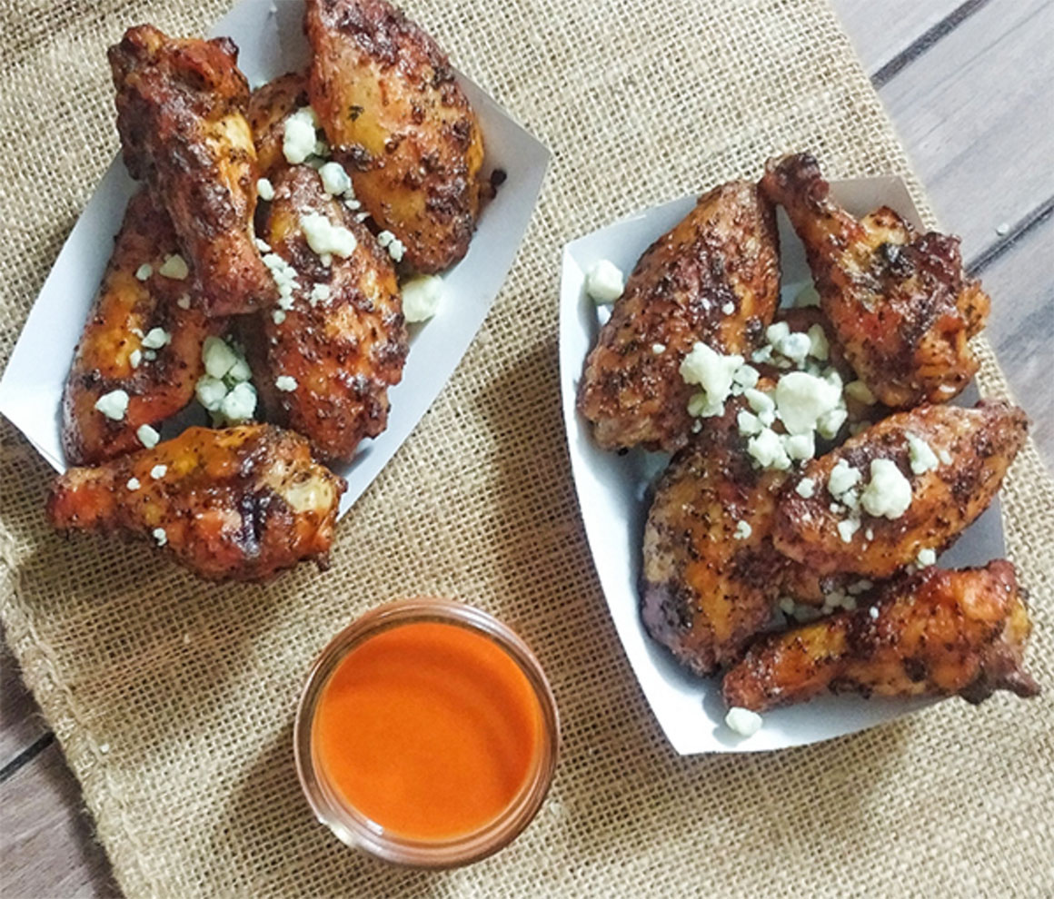 trays of wings with dipping sauce