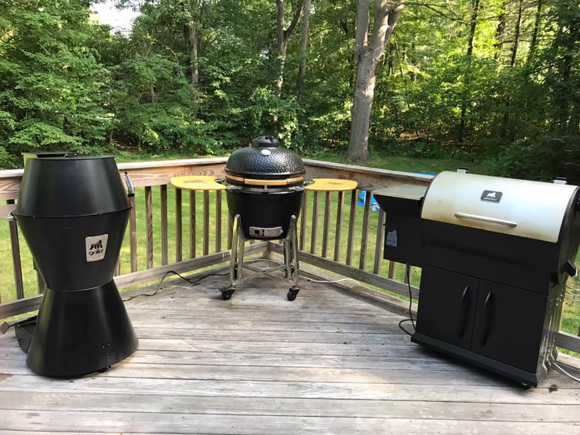 three different types of grilla grills on a patio deck