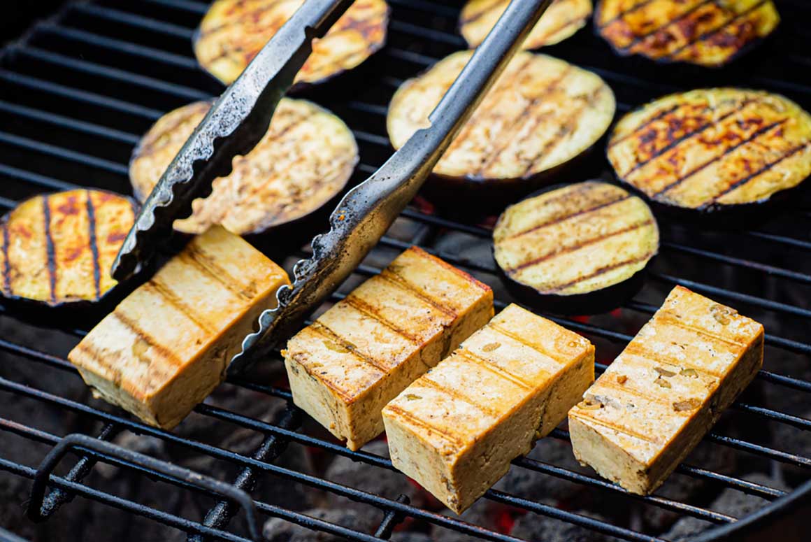 tofu being grilled with zucchini 